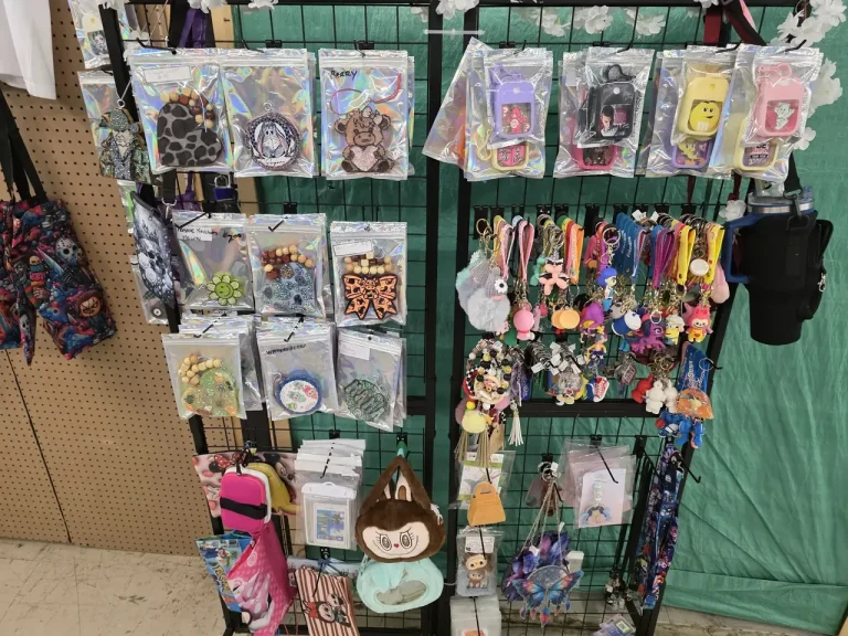 Wall display of keychains, charms and accessories at Glowing Creations